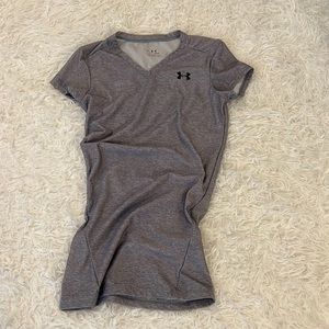 Under armor dri fit shirt in a size small.